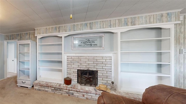 carpeted living room featuring a fireplace and wooden walls