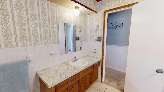 bathroom with tile patterned flooring and vanity