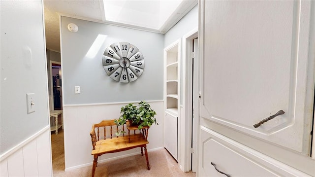 doorway with washer / dryer and light carpet