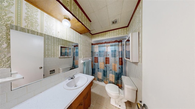 bathroom featuring tile patterned floors, walk in shower, vanity, tile walls, and toilet