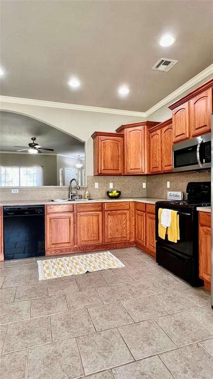 kitchen with backsplash, black appliances, sink, ceiling fan, and ornamental molding