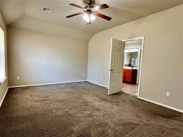 spare room with ceiling fan, carpet, and lofted ceiling