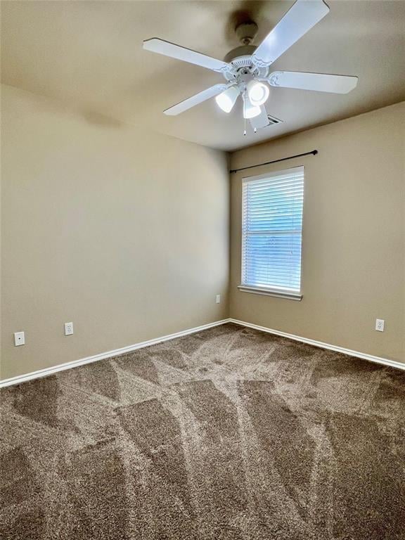 carpeted empty room with ceiling fan