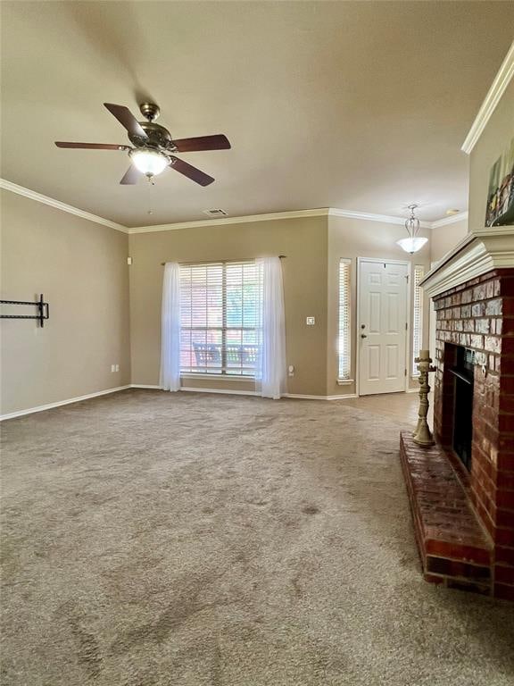 unfurnished living room with a fireplace, carpet floors, ceiling fan, and crown molding