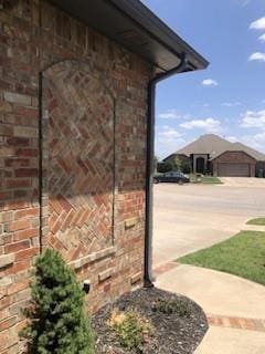 view of side of home featuring a garage