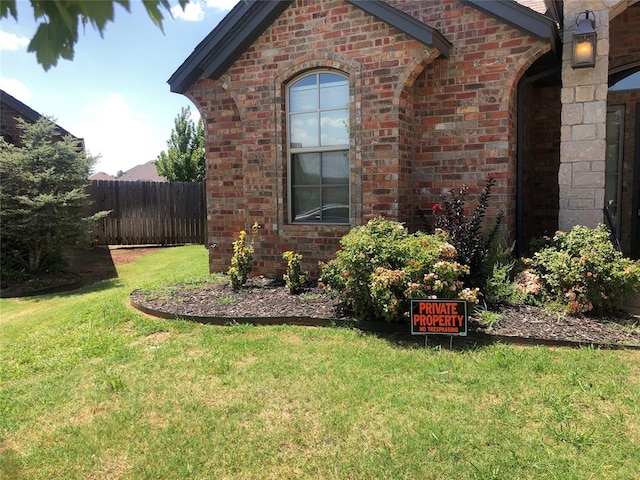 view of property exterior featuring a lawn