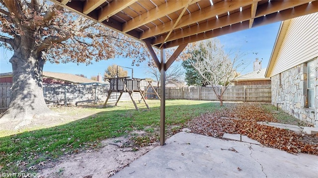 view of yard with a playground and a patio area