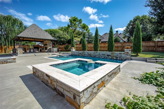 view of swimming pool featuring an in ground hot tub, a gazebo, a patio, and area for grilling