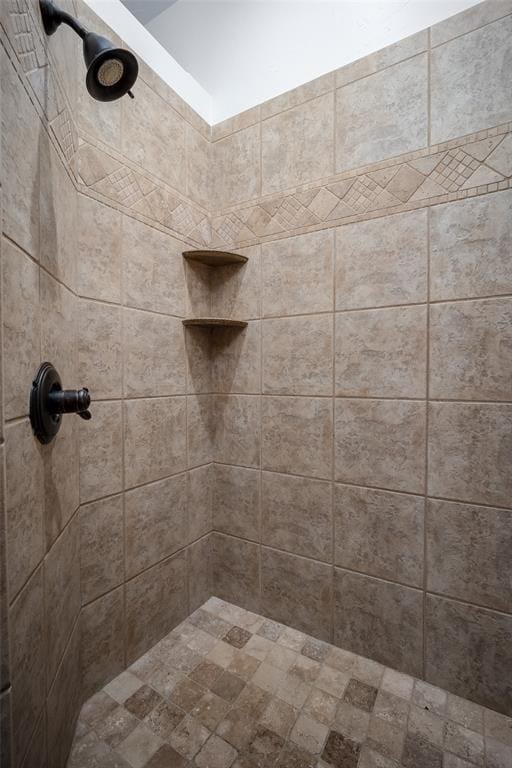 bathroom with a tile shower