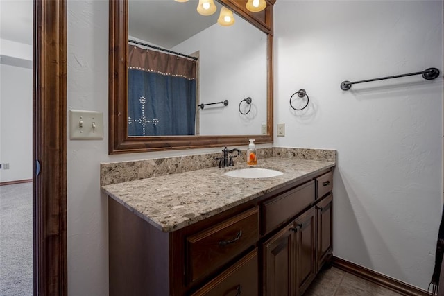 bathroom with tile patterned flooring and vanity