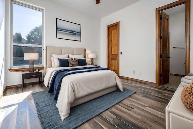 bedroom with hardwood / wood-style floors and ceiling fan