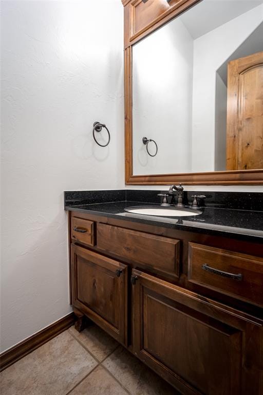 bathroom featuring tile patterned flooring and vanity