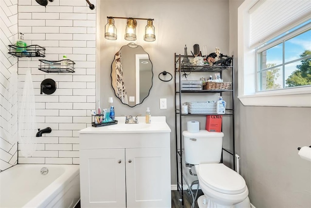 208 S Mockingbird Dr, Altus, OK 73521 - bathroom with vanity, toilet, shower / washtub combination, and baseboards