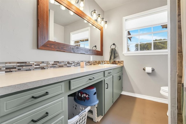 208 S Mockingbird Dr, Altus, OK 73521 - full bathroom with vanity, baseboards, and toilet