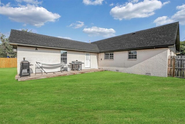 208 S Mockingbird Dr, Altus, OK 73521 - back of house with brick siding, roof with shingles, a patio, and crawl space