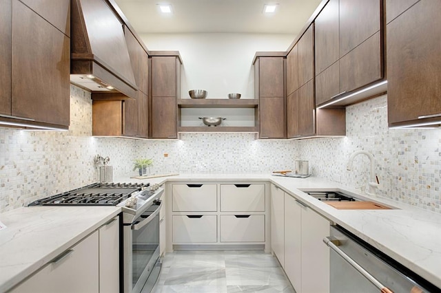 kitchen featuring decorative backsplash, stainless steel appliances, light stone counters, and premium range hood