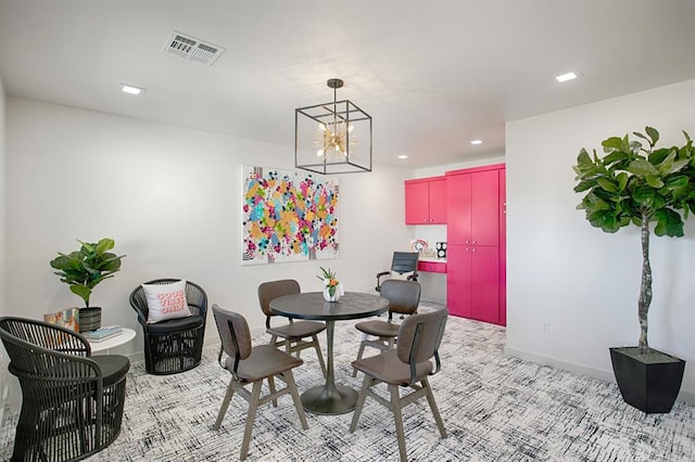 dining space featuring a chandelier