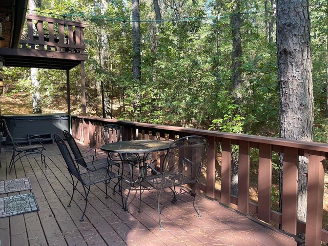 deck with a hot tub