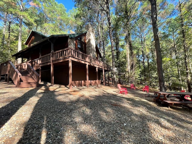 view of side of home featuring a deck