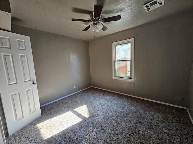 interior space with ceiling fan and a textured ceiling