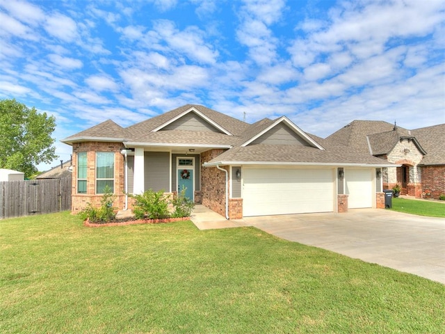 craftsman house with a garage and a front lawn