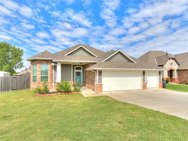 1301 Atalon Dr, Moore, OK 73160 - view of front of property featuring brick siding, a garage, driveway, and roof with shingles