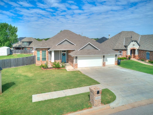 1301 Atalon Dr, Moore, OK 73160 - view of front of property with an attached garage, brick siding, driveway, and a shingled roof