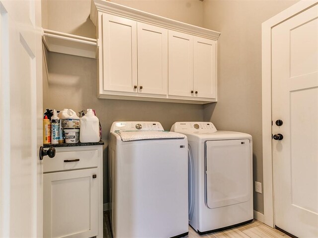 1301 Atalon Dr, Moore, OK 73160 - laundry room featuring cabinet space and washer and dryer