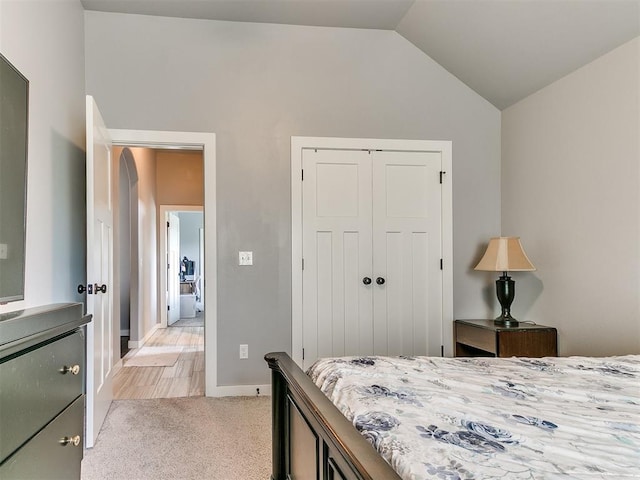 1301 Atalon Dr, Moore, OK 73160 - bedroom featuring vaulted ceiling, a closet, and light colored carpet