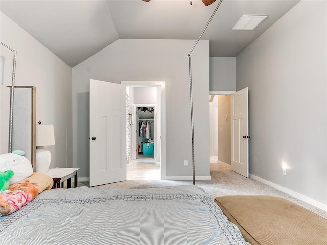 1301 Atalon Dr, Moore, OK 73160 - bedroom with light carpet, lofted ceiling, a walk in closet, and a closet