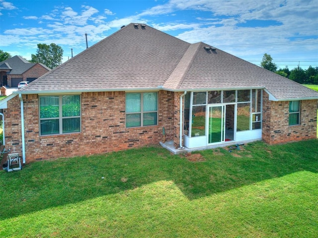 1301 Atalon Dr, Moore, OK 73160 - rear view of property with brick siding, a yard, a sunroom, and roof with shingles