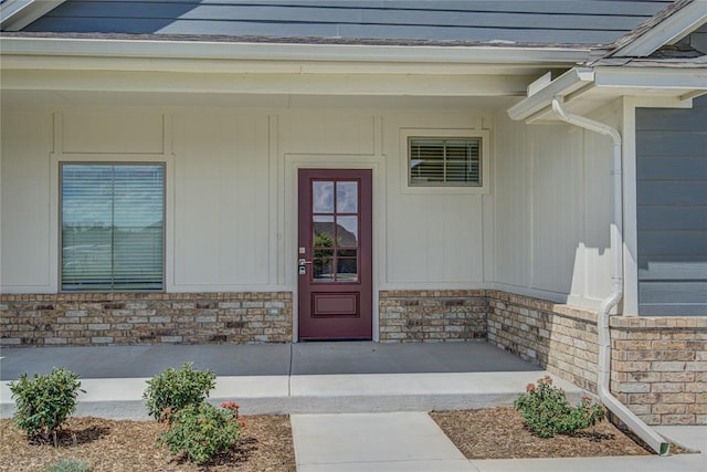 doorway to property featuring a porch