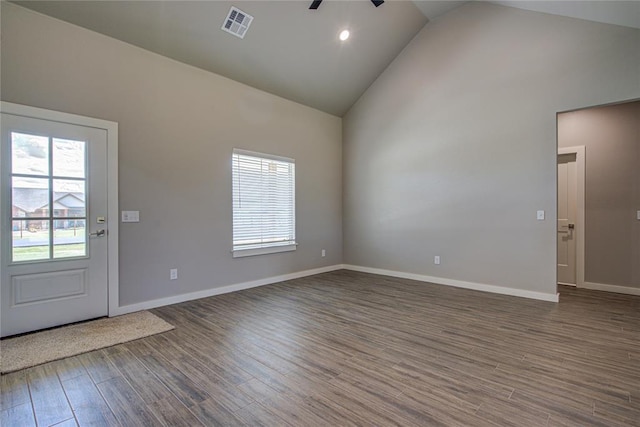 foyer entrance featuring ceiling fan, dark hardwood / wood-style flooring, and high vaulted ceiling