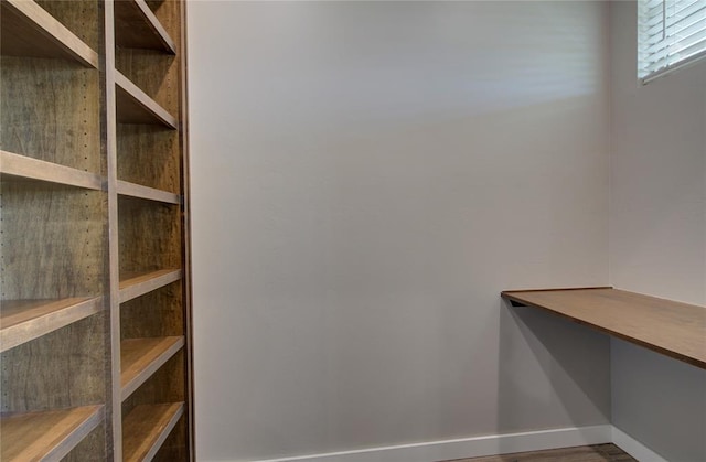 spacious closet with hardwood / wood-style floors