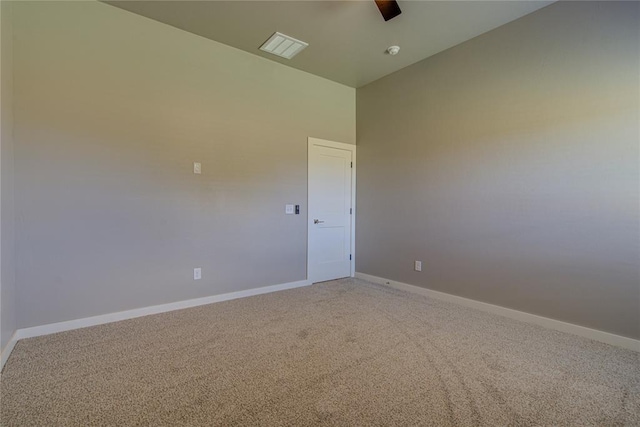 spare room with carpet flooring and ceiling fan