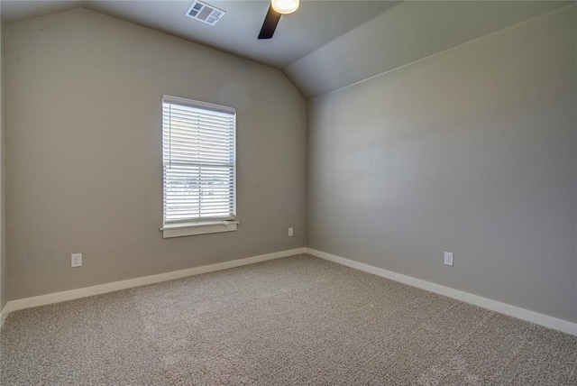 unfurnished room with ceiling fan, carpet floors, and vaulted ceiling