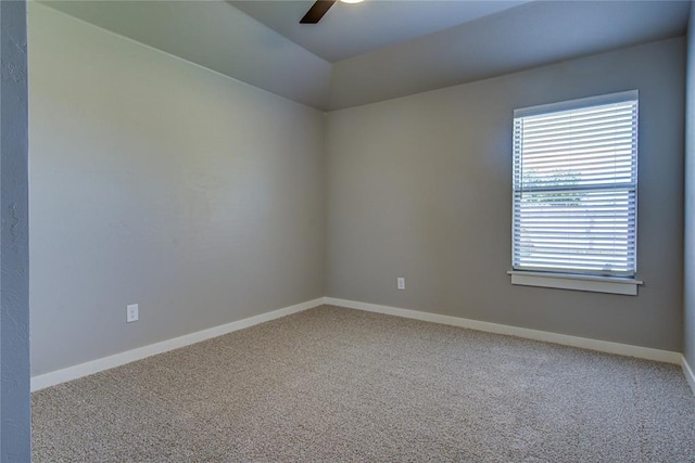 spare room featuring carpet flooring and ceiling fan