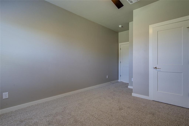 unfurnished bedroom featuring light carpet and ceiling fan