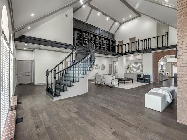 interior space featuring hardwood / wood-style floors and high vaulted ceiling