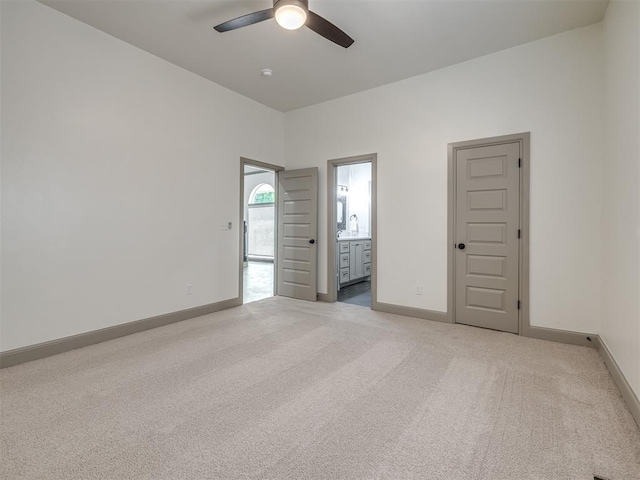 carpeted empty room with ceiling fan