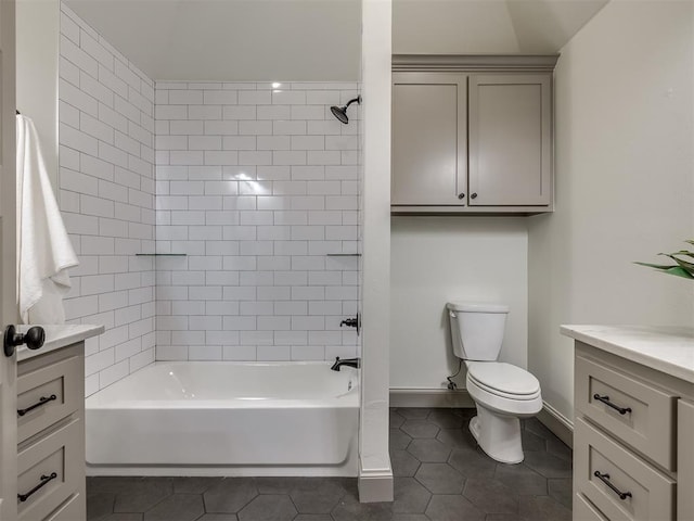 full bathroom with tile patterned flooring, vanity, toilet, and tiled shower / bath combo