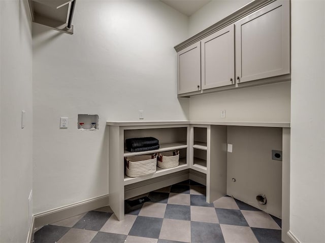 laundry area with cabinets, washer hookup, and hookup for an electric dryer