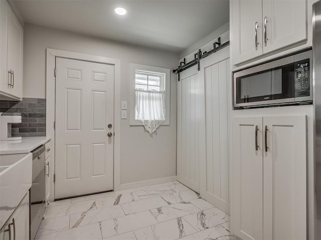 mudroom with a barn door