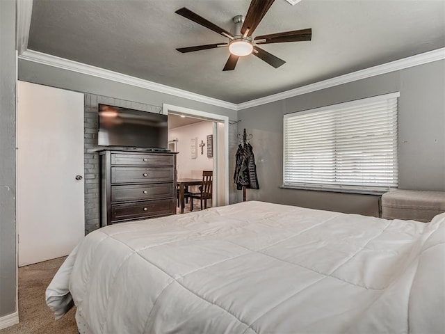 bedroom with ceiling fan, crown molding, and light carpet