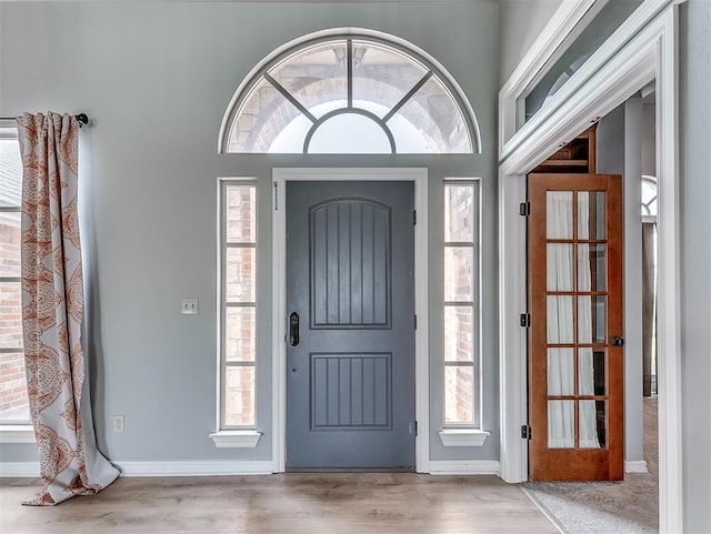 entrance foyer featuring light hardwood / wood-style floors and a wealth of natural light