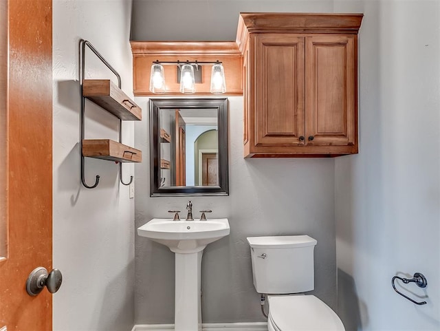 bathroom featuring toilet