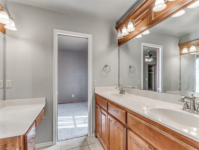 bathroom with tile patterned floors, ceiling fan, and vanity