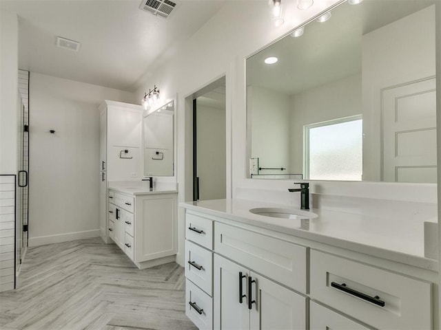 bathroom featuring vanity and parquet floors