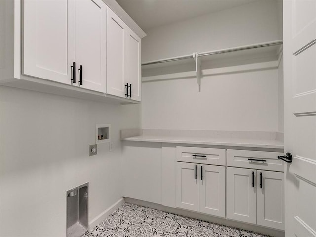 laundry room featuring cabinets, hookup for a washing machine, hookup for an electric dryer, and light tile patterned floors