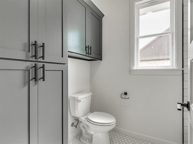 bathroom featuring tile patterned floors and toilet